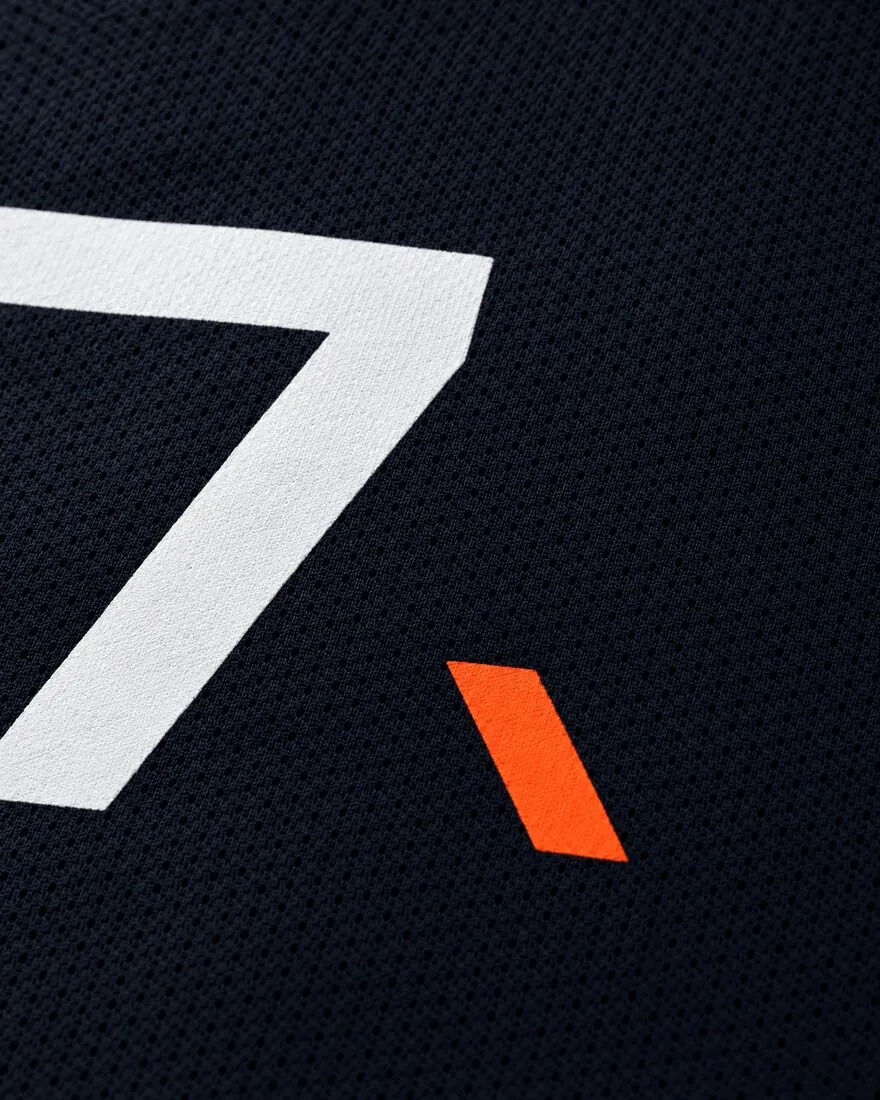 Close-up of the number and the orange Tail on mesh